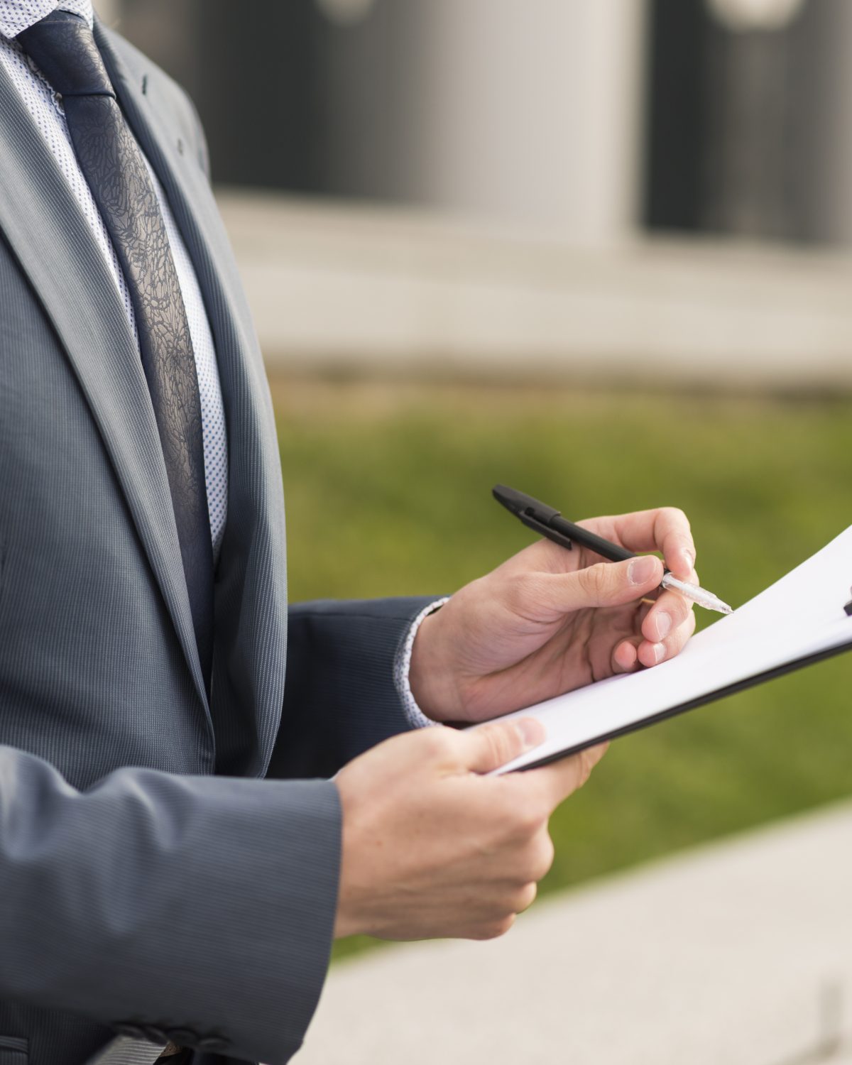 businessman-writing-clipboard